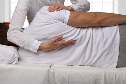 Male patient receiving chiropractic treatment from professional clinician in Lehigh Valley.